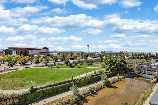 exterior space with a city view and a yard