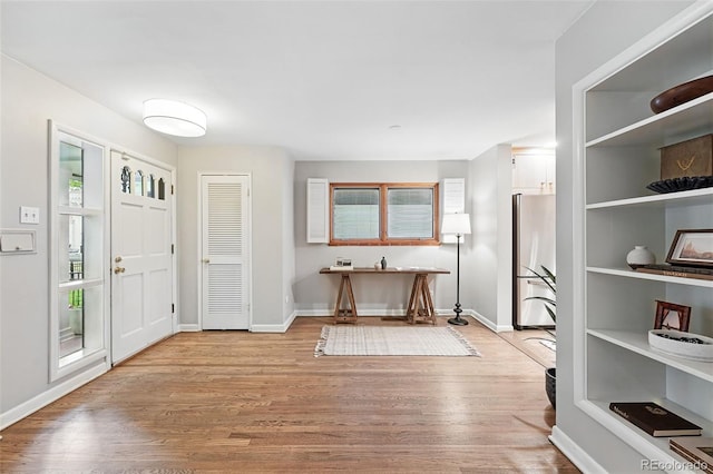 11 S Albion St, Denver, CO 80246 - foyer featuring light wood-style flooring and baseboards