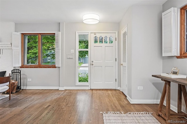11 S Albion St, Denver, CO 80246 - entrance foyer with baseboards and wood finished floors