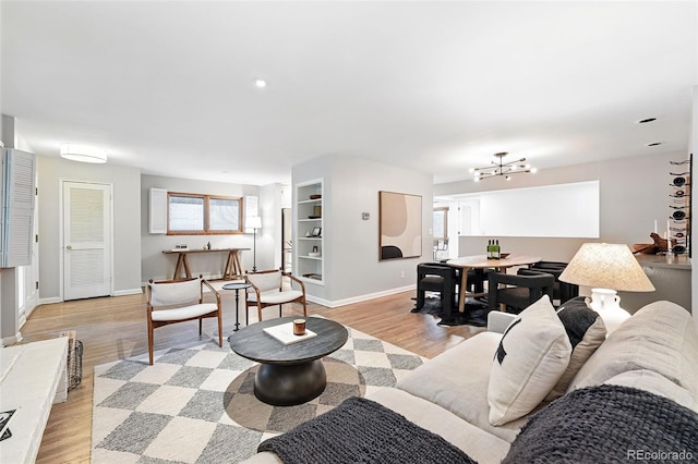 11 S Albion St, Denver, CO 80246 - living room featuring light wood-type flooring and baseboards