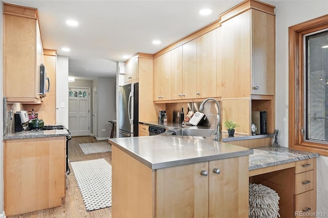 11 S Albion St, Denver, CO 80246 - kitchen with appliances with stainless steel finishes, a sink, light brown cabinets, a peninsula, and light wood-type flooring