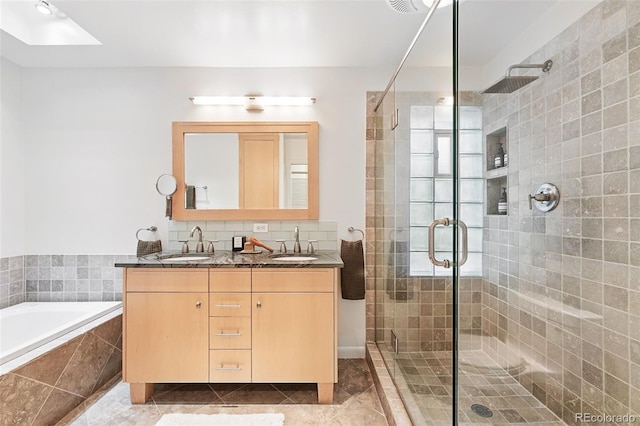 11 S Albion St, Denver, CO 80246 - full bath featuring a stall shower, double vanity, a garden tub, tile patterned floors, and a skylight