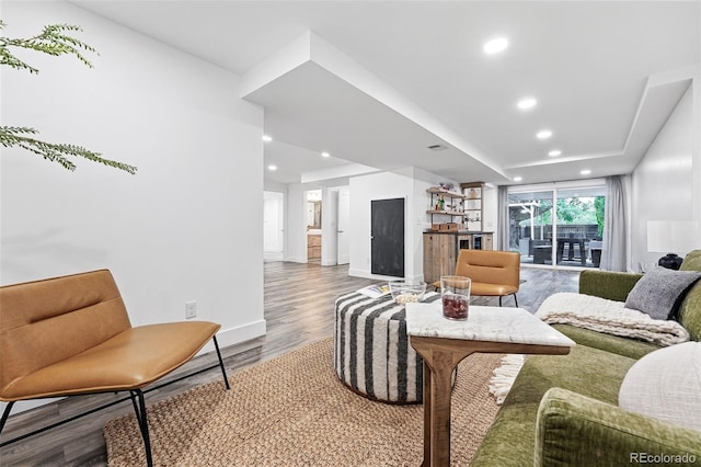 11 S Albion St, Denver, CO 80246 - living room featuring wood finished floors, a bar, recessed lighting, and baseboards