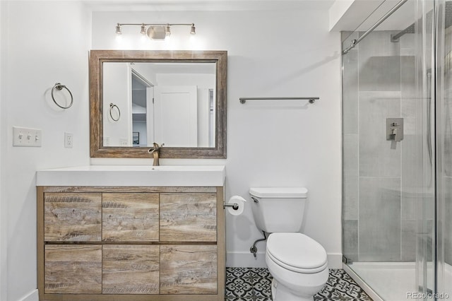 11 S Albion St, Denver, CO 80246 - bathroom featuring toilet, vanity, a shower stall, baseboards, and tile patterned flooring