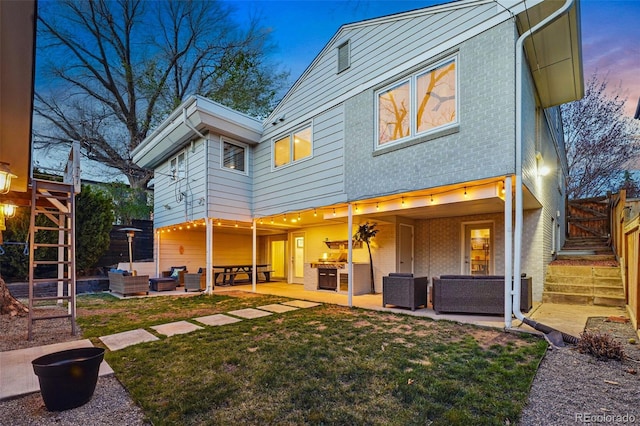 11 S Albion St, Denver, CO 80246 - rear view of house featuring an outdoor living space, a patio, and brick siding