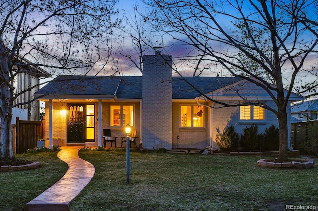 11 S Albion St, Denver, CO 80246 - view of front facade featuring a chimney and brick siding