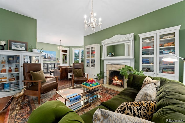 1154 N Clarkson St, Denver, CO 80218 - living area featuring a chandelier, a fireplace, and wood finished floors