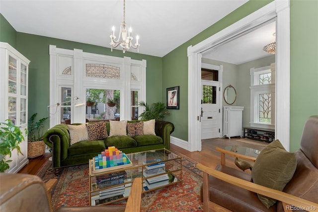 1154 N Clarkson St, Denver, CO 80218 - living room with a chandelier, wood finished floors, and radiator heating unit