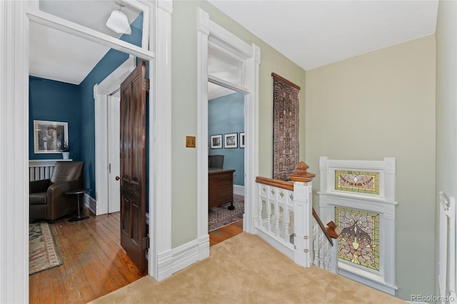 1154 N Clarkson St, Denver, CO 80218 - corridor with hardwood / wood-style floors and an upstairs landing