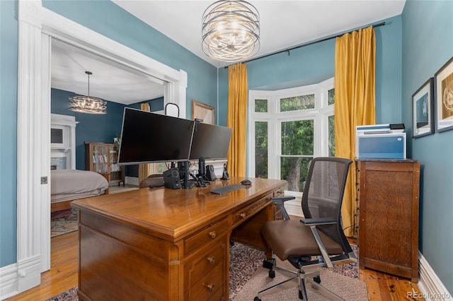 1154 N Clarkson St, Denver, CO 80218 - office with a chandelier and light wood-style floors