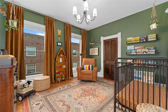 1154 N Clarkson St, Denver, CO 80218 - living area featuring wood finished floors and a chandelier