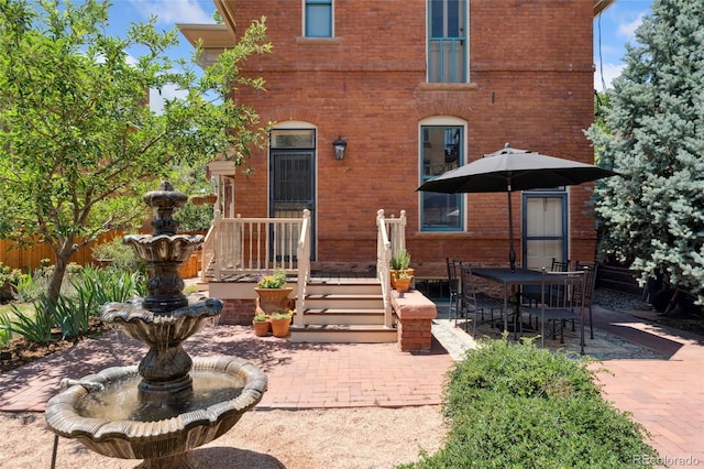1154 N Clarkson St, Denver, CO 80218 - rear view of house with brick siding and a patio area