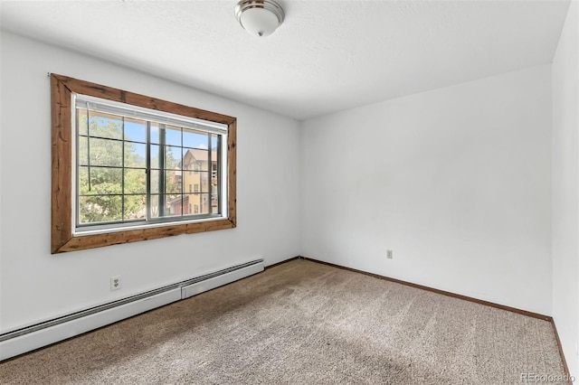 675 Straight Creek Dr Unit 301, Dillon, CO 80435 - unfurnished room featuring a baseboard radiator and carpet floors