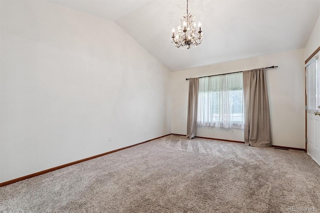 13457 Glen Cir, Broomfield, CO 80020 - spare room with lofted ceiling, carpet, and a chandelier