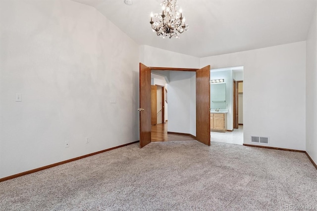 13457 Glen Cir, Broomfield, CO 80020 - unfurnished room featuring light carpet and a chandelier