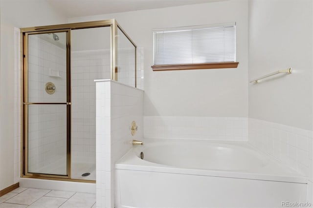 13457 Glen Cir, Broomfield, CO 80020 - bathroom featuring a bath, a shower stall, and tile patterned floors