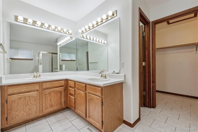 13457 Glen Cir, Broomfield, CO 80020 - bathroom with tile patterned flooring, double vanity, a stall shower, and a walk in closet