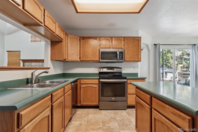 13457 Glen Cir, Broomfield, CO 80020 - kitchen with stainless steel appliances, dark countertops, and brown cabinetry