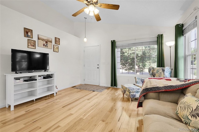 2659 S Halifax St, Aurora, CO 80013 - living area with lofted ceiling, wood finished floors, and ceiling fan