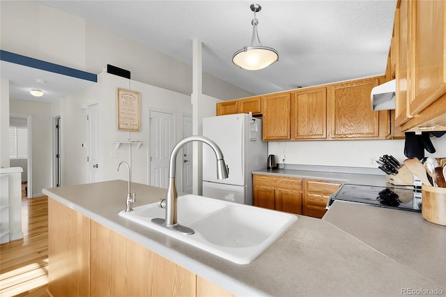 2659 S Halifax St, Aurora, CO 80013 - kitchen featuring freestanding refrigerator, pendant lighting, exhaust hood, range, and light wood-style flooring