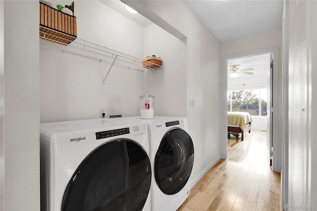 2659 S Halifax St, Aurora, CO 80013 - washroom with washer and dryer, light wood-type flooring, and a ceiling fan