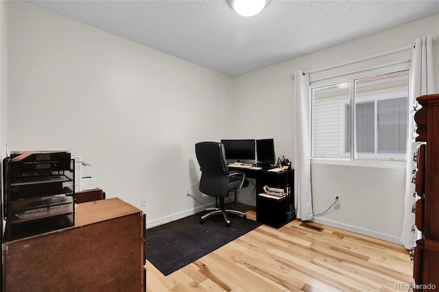 2659 S Halifax St, Aurora, CO 80013 - office space featuring wood finished floors and a textured ceiling