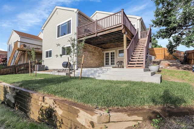 2659 S Halifax St, Aurora, CO 80013 - back of house with stairway, a wooden deck, a patio, and stone siding