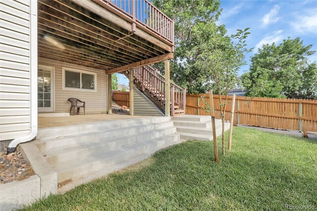 2659 S Halifax St, Aurora, CO 80013 - fenced backyard featuring stairs, a deck, and a patio area