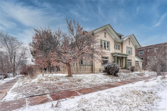 traditional-style house featuring brick siding