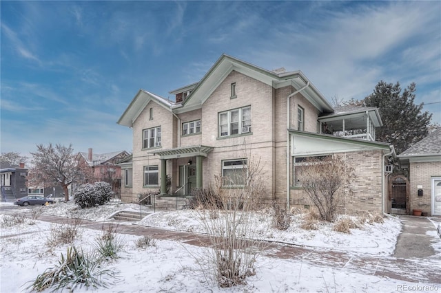 traditional home featuring brick siding