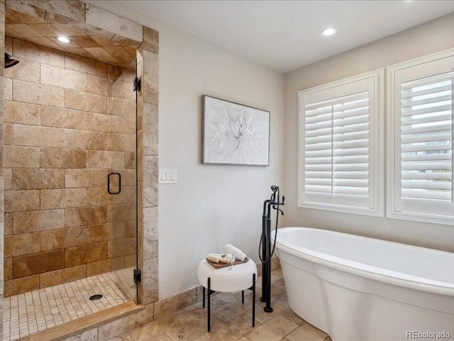 bathroom featuring plus walk in shower