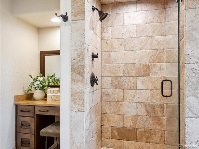 bathroom with a shower with door