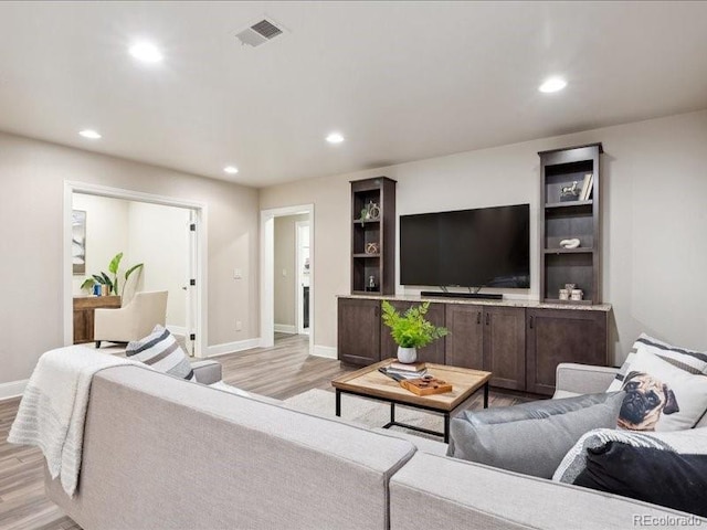 living room with light hardwood / wood-style floors