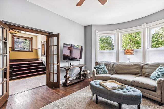 living room with ceiling fan, hardwood / wood-style floors, and french doors