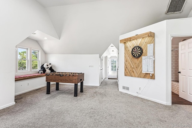 playroom with carpet and lofted ceiling