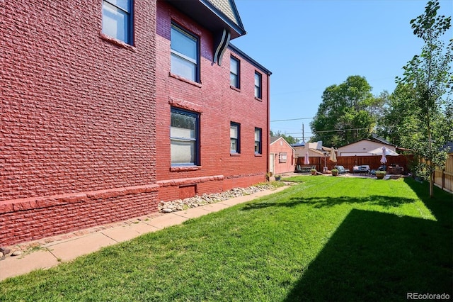 view of property exterior with a yard