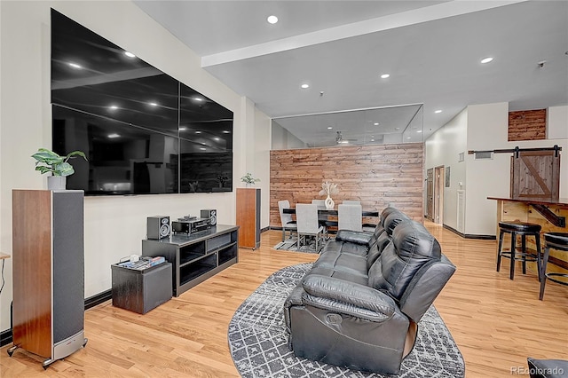 living room featuring hardwood / wood-style flooring and a barn door