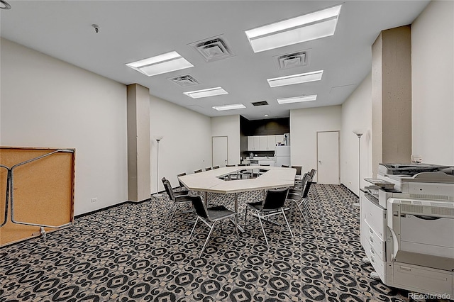 dining room featuring carpet flooring