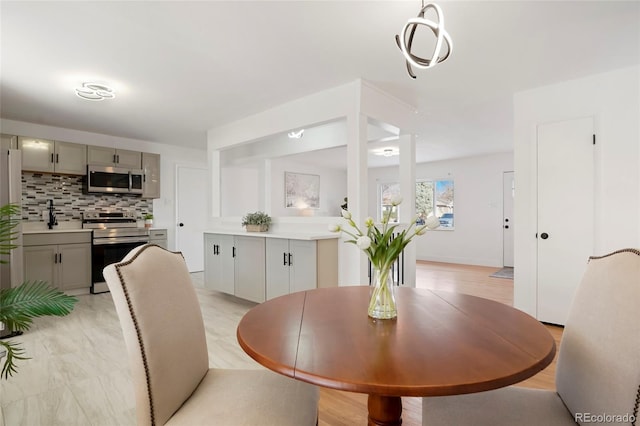 dining space with light hardwood / wood-style flooring