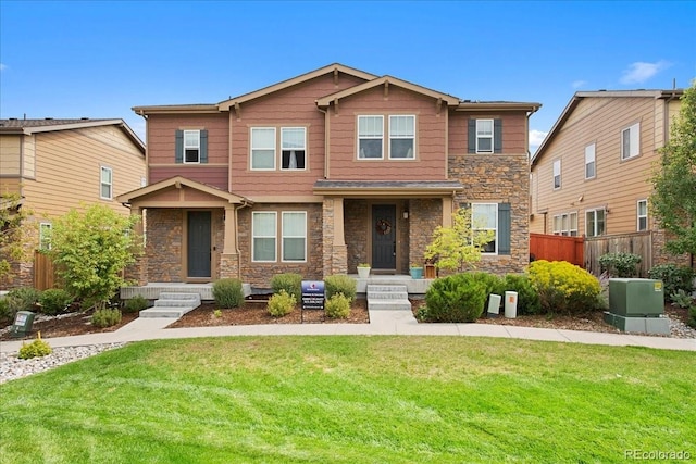 craftsman house featuring a front yard