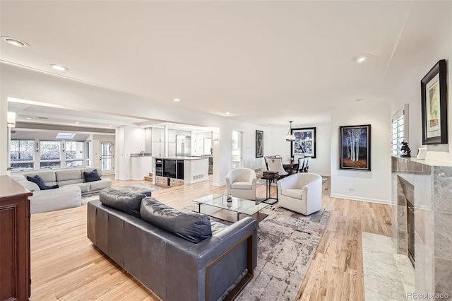 living room with light hardwood / wood-style floors