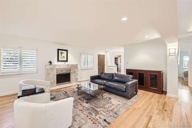 2 Elm St, Denver, CO 80220 - living area featuring a high end fireplace, wood finished floors, baseboards, and recessed lighting