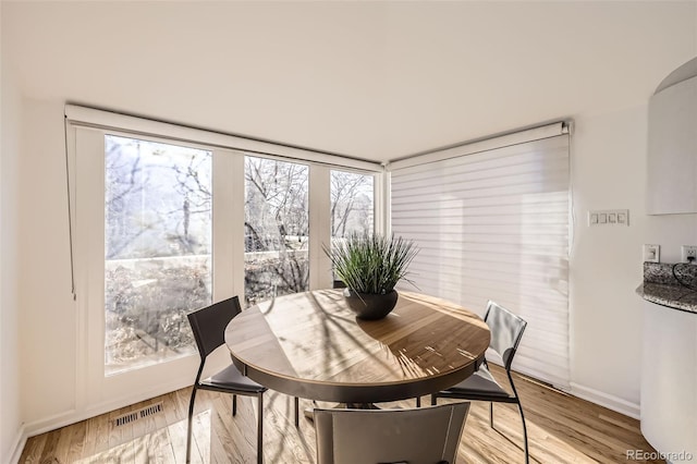 2 Elm St, Denver, CO 80220 - dining area with baseboards and light wood-type flooring