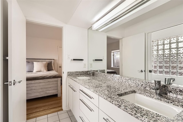 2 Elm St, Denver, CO 80220 - bathroom featuring ensuite bathroom, double vanity, and tile patterned floors