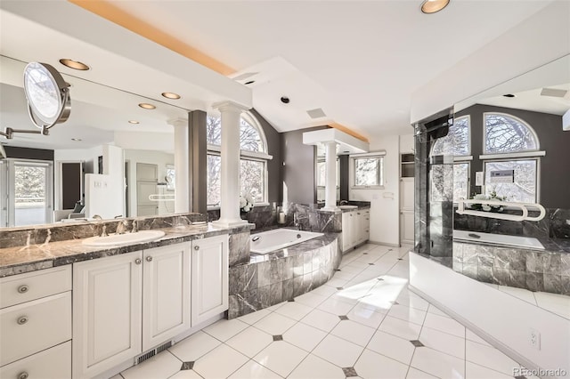 2 Elm St, Denver, CO 80220 - full bath with ornate columns, a bath, vanity, vaulted ceiling, and recessed lighting