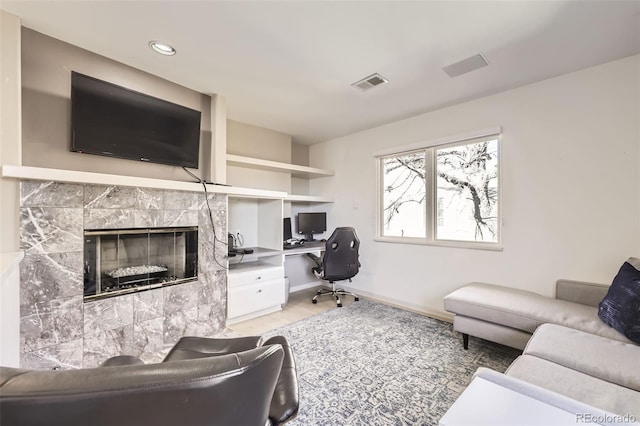 2 Elm St, Denver, CO 80220 - living room with baseboards, wood finished floors, a desk, a fireplace, and recessed lighting