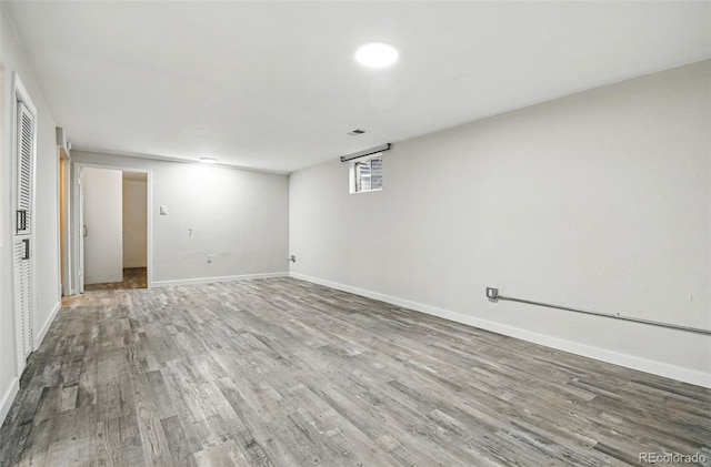 6948 W 70th Ave, Arvada, CO 80003 - basement with baseboards and wood finished floors