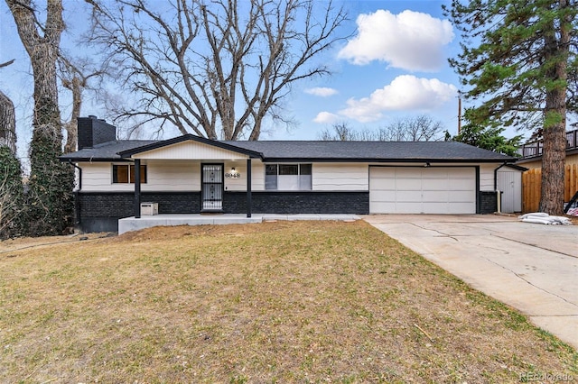 6948 W 70th Ave, Arvada, CO 80003 - view of front of property featuring a chimney, an attached garage, concrete driveway, a front lawn, and brick siding