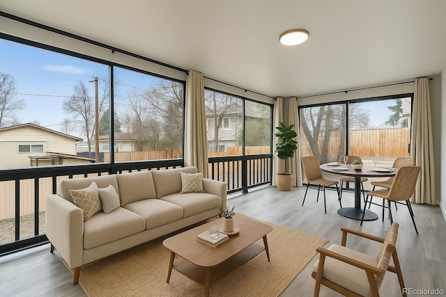 6948 W 70th Ave, Arvada, CO 80003 - sunroom featuring wood finished floors and plenty of natural light