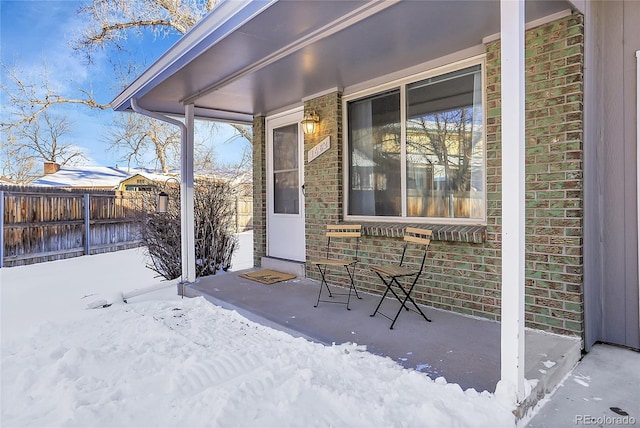 view of snow covered patio